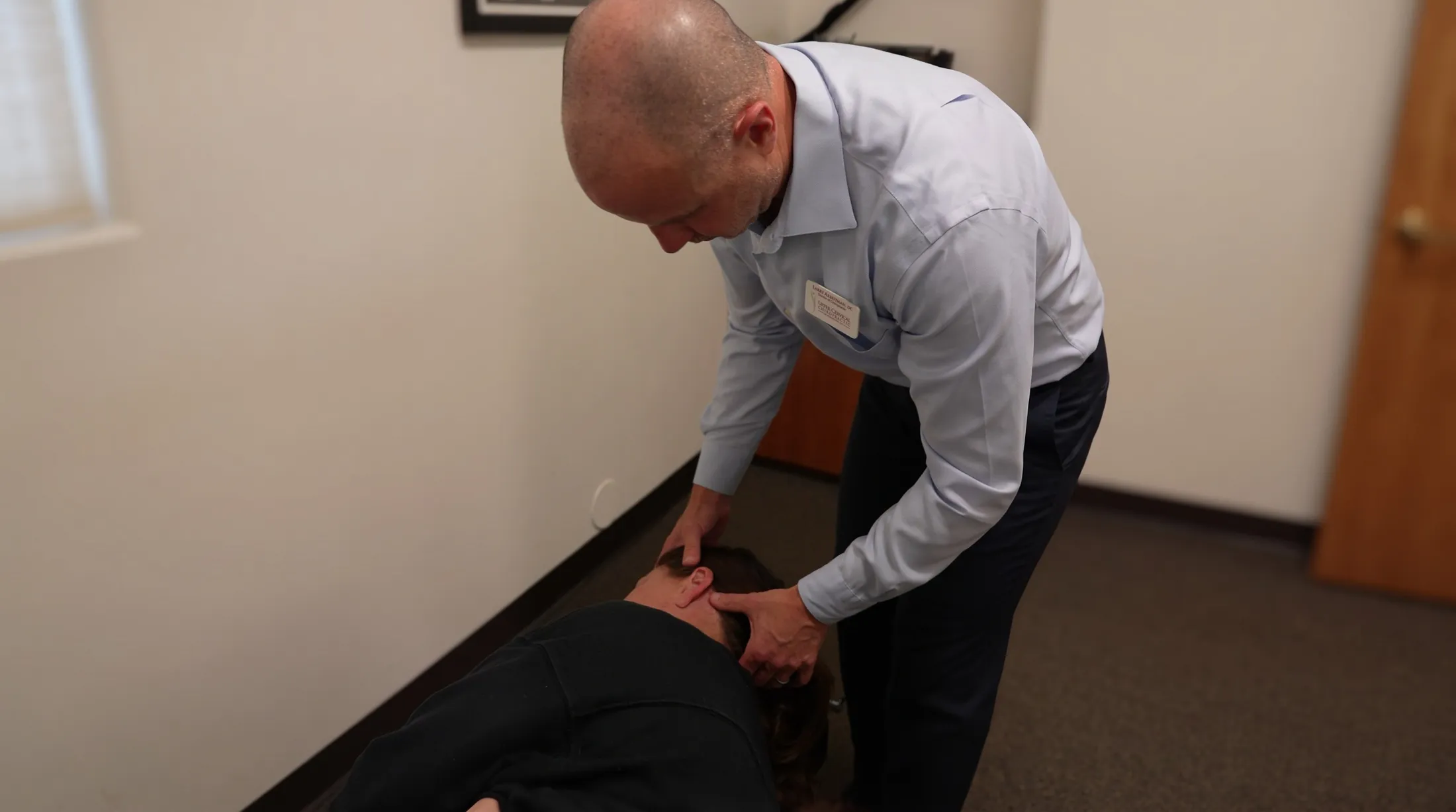 Dr. Larry Arbeitman giving a gentle upper cervical adjustment